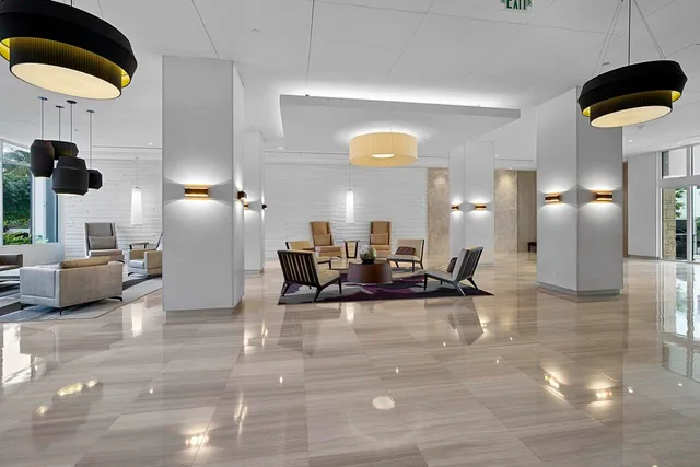 a living room with furniture and a lamp