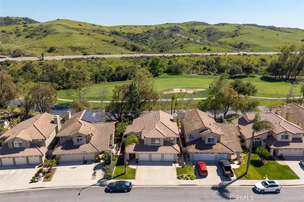 an aerial view of a house with a garden