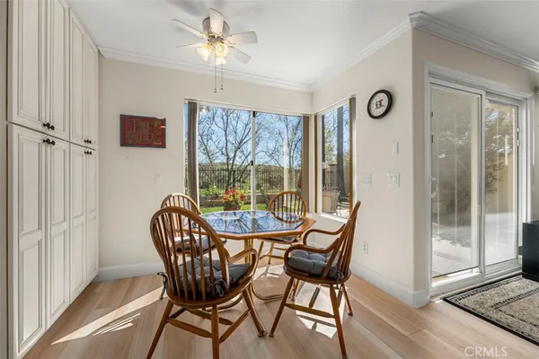 a view of a dining room with furniture window and outside view