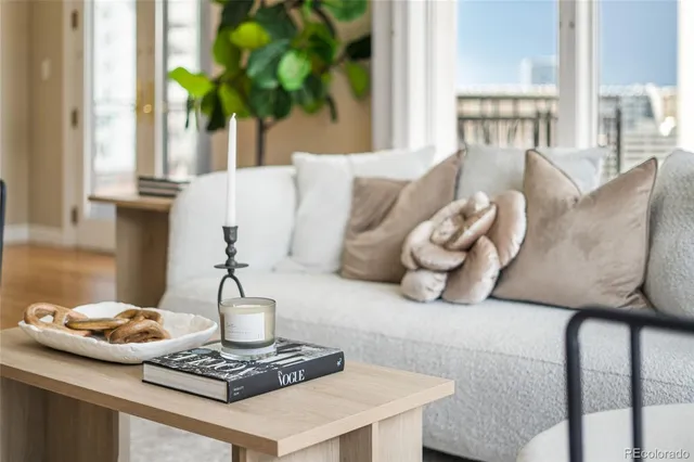 a vase of flowers sitting on a table with a fireplace