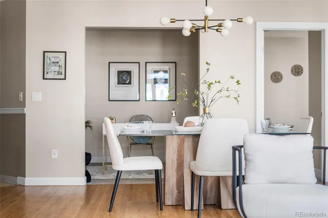 a view of a dining room with a table and chairs