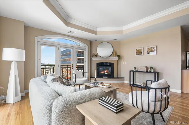 a living room with furniture a fireplace and a table
