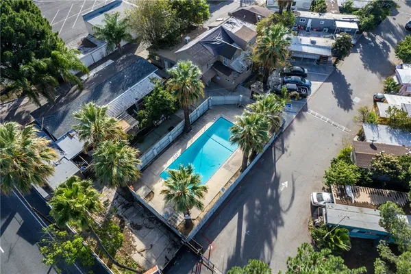 an aerial view of house with a yard
