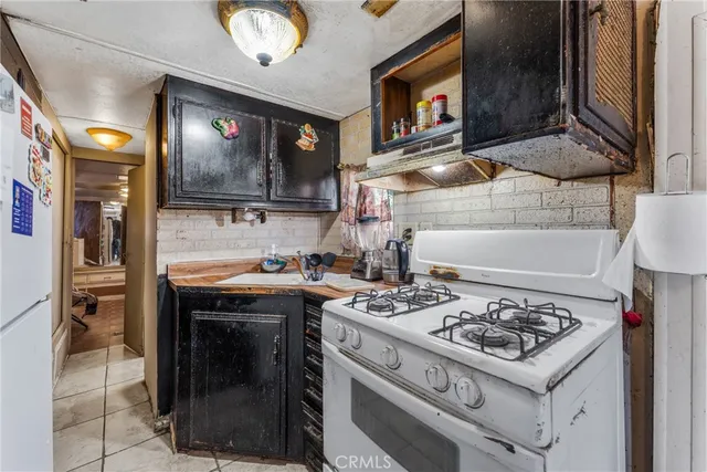 a kitchen with a stove and a microwave