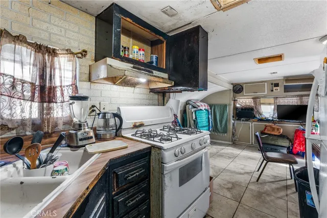 a kitchen with stainless steel appliances granite countertop a stove and a sink