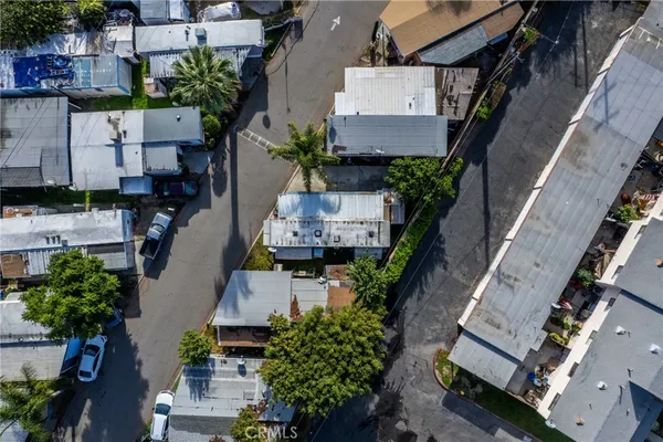 an aerial view of a house with outdoor space