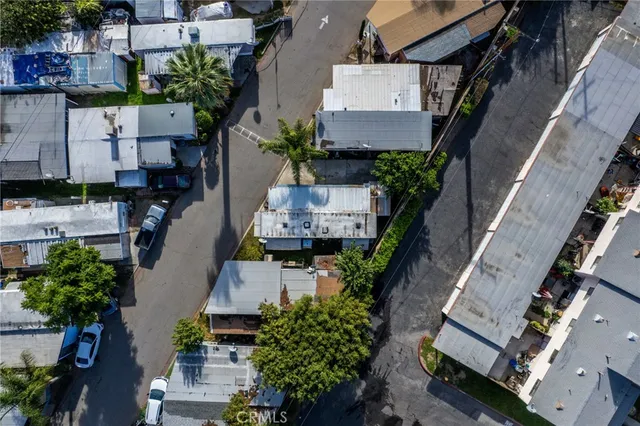 an aerial view of a house with outdoor space