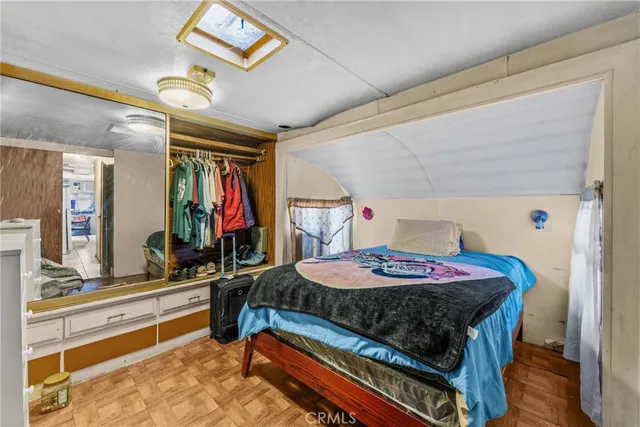 a bedroom with a bed and a table