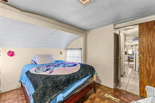 a bedroom with a bed and a table