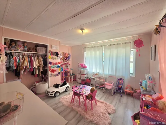 a living room filled with furniture and a gym