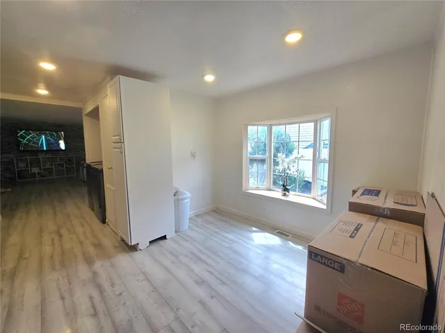 a view of an empty room and window