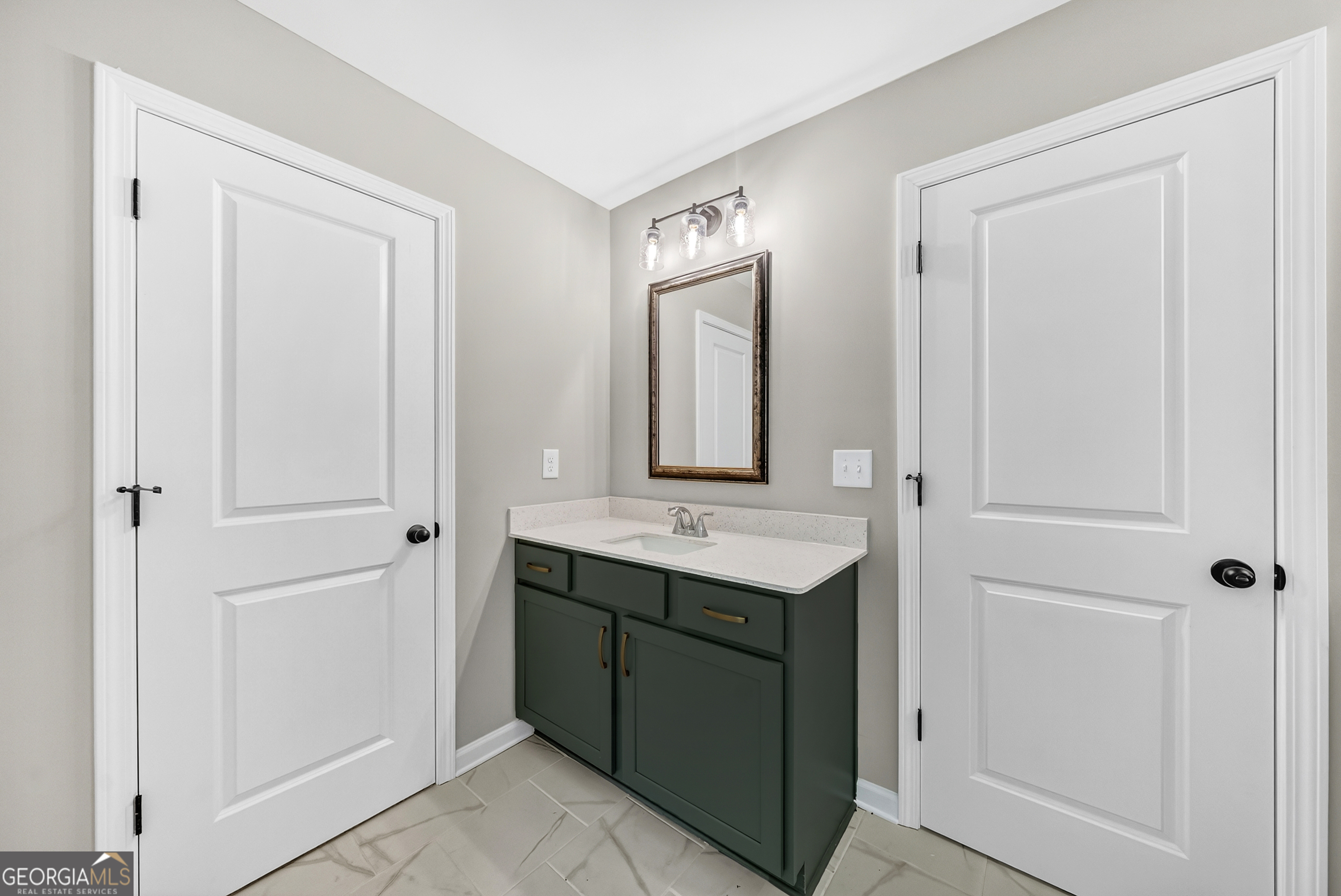38 Oak Ridge Drive, Unit 26 Waverly Hall, GA 31831 - Photo 24 of 37 a bathroom with a sink and a mirror