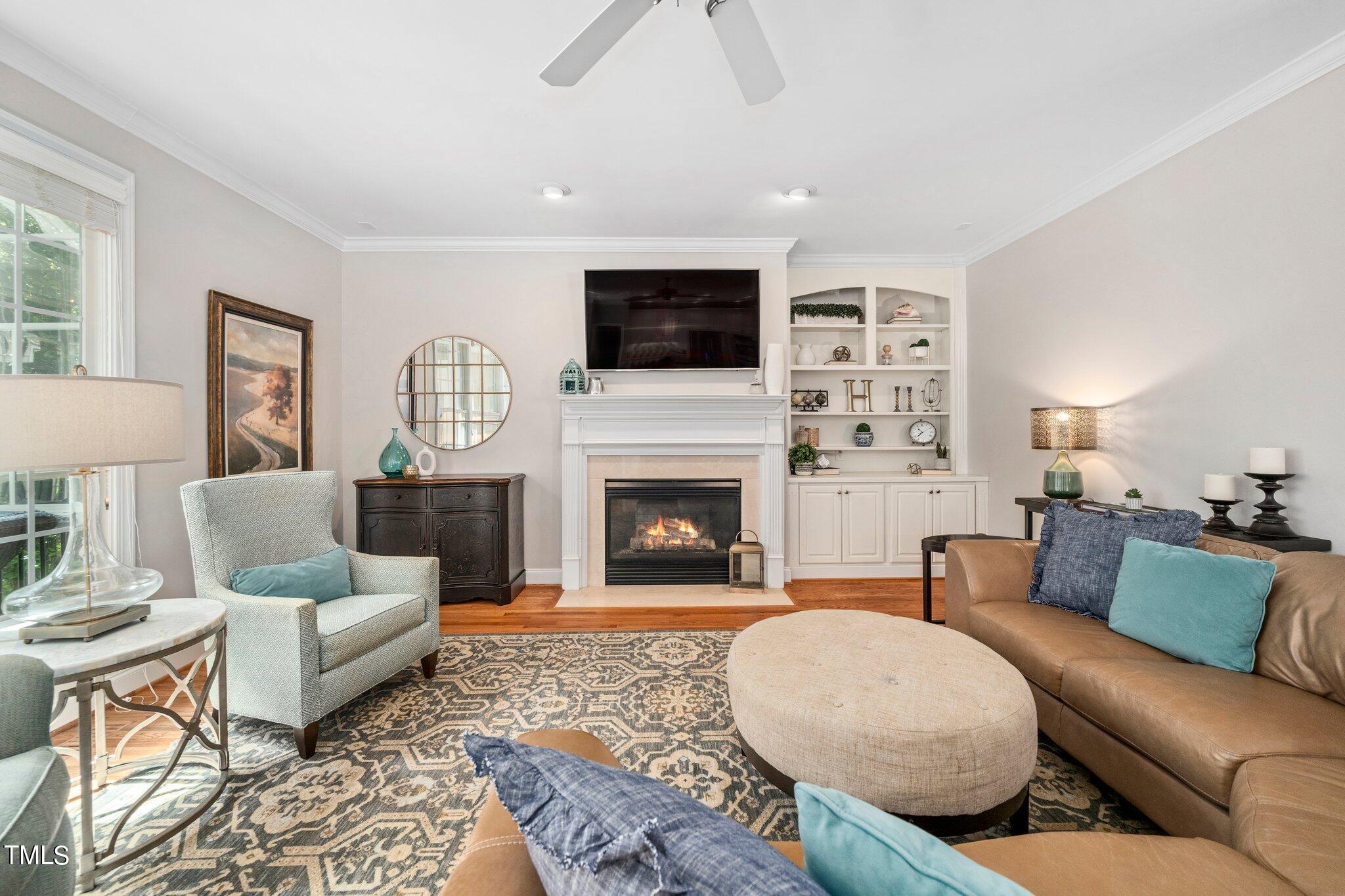 109 Chilcott Lane Apex, NC 27502 - Photo 13 of 34 a living room with furniture and a fireplace