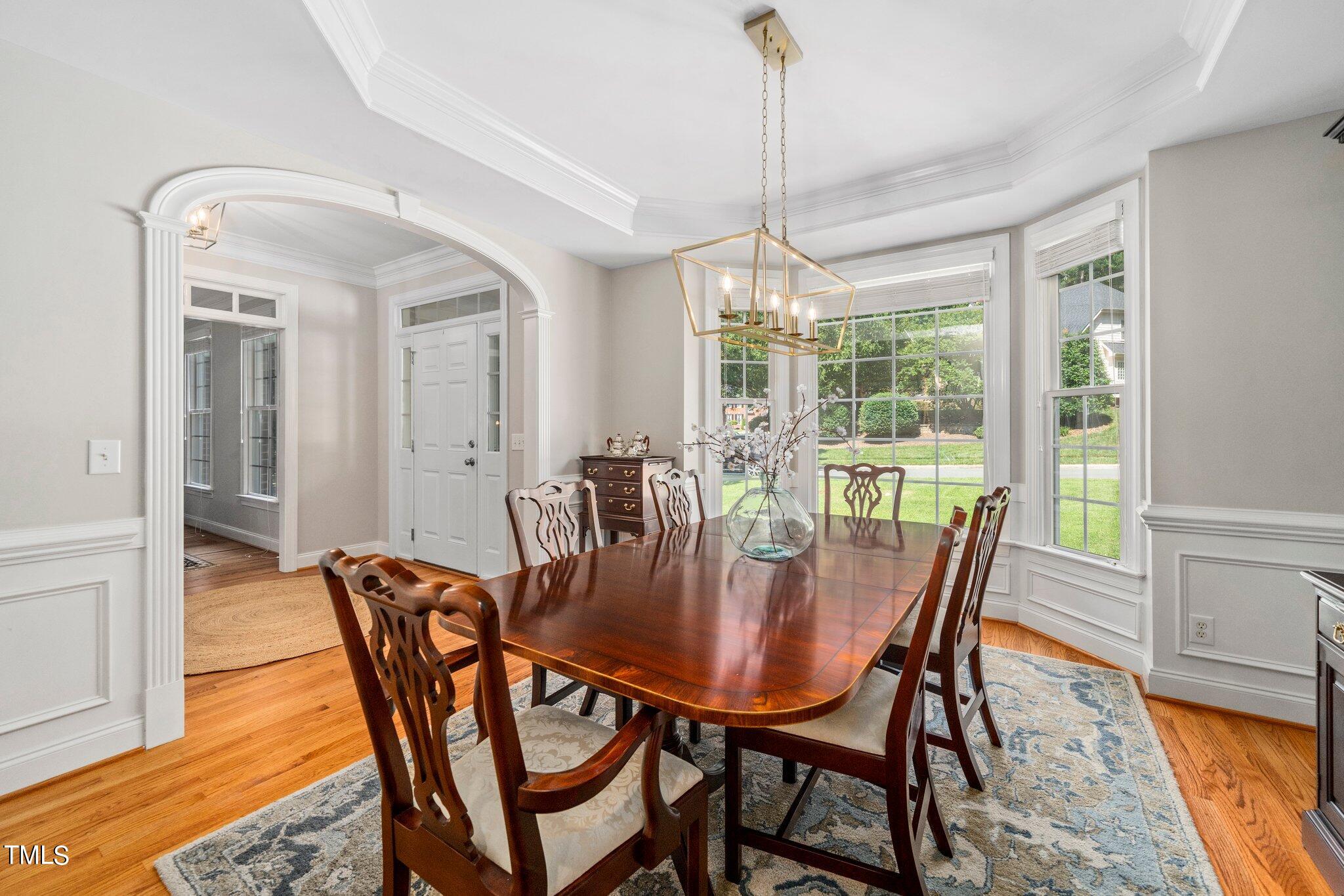 109 Chilcott Lane Apex, NC 27502 - Photo 14 of 34 a view of a dining room with furniture window and wooden floor