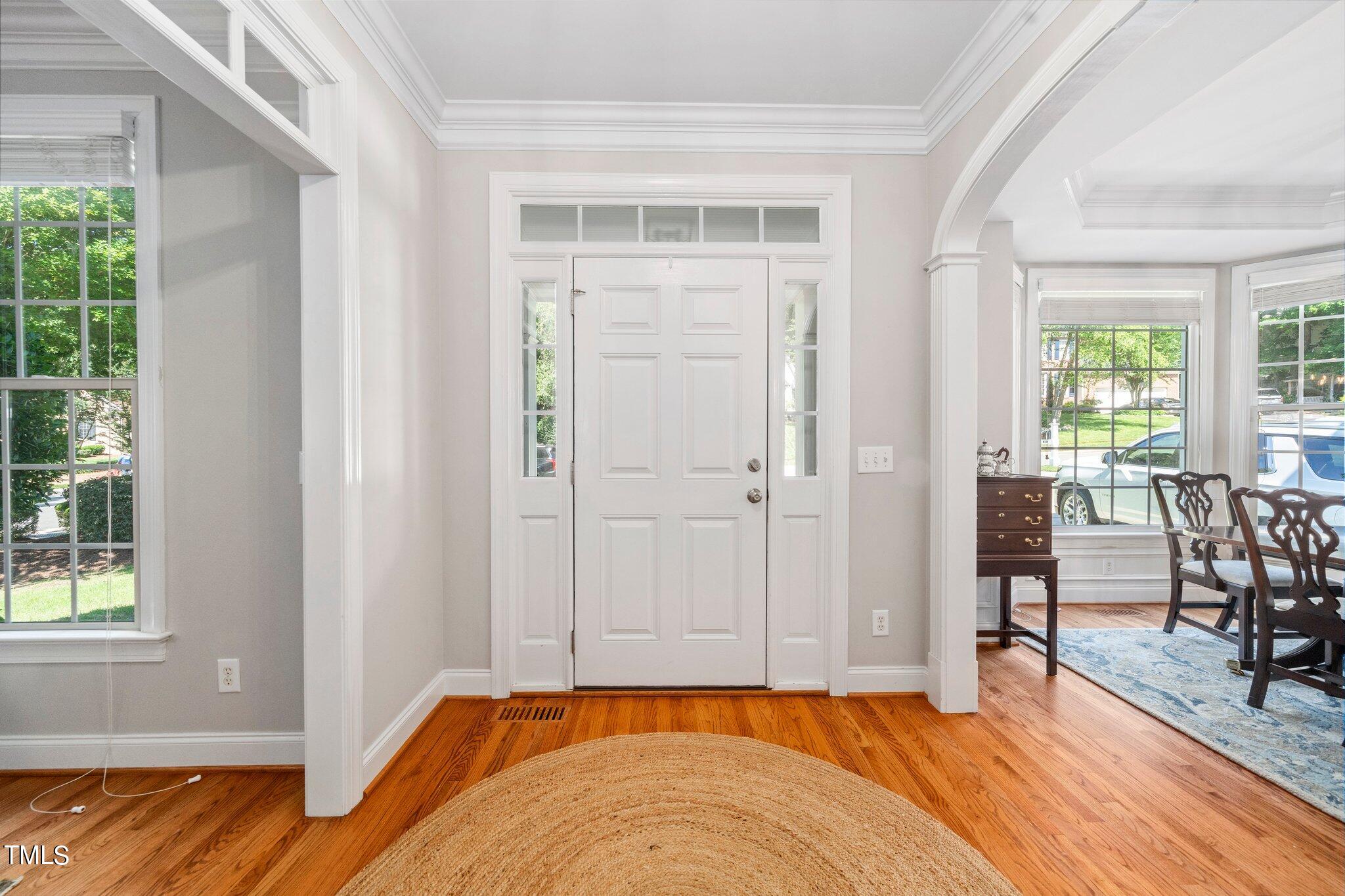 109 Chilcott Lane Apex, NC 27502 - Photo 16 of 34 a view of room with window and wooden floor