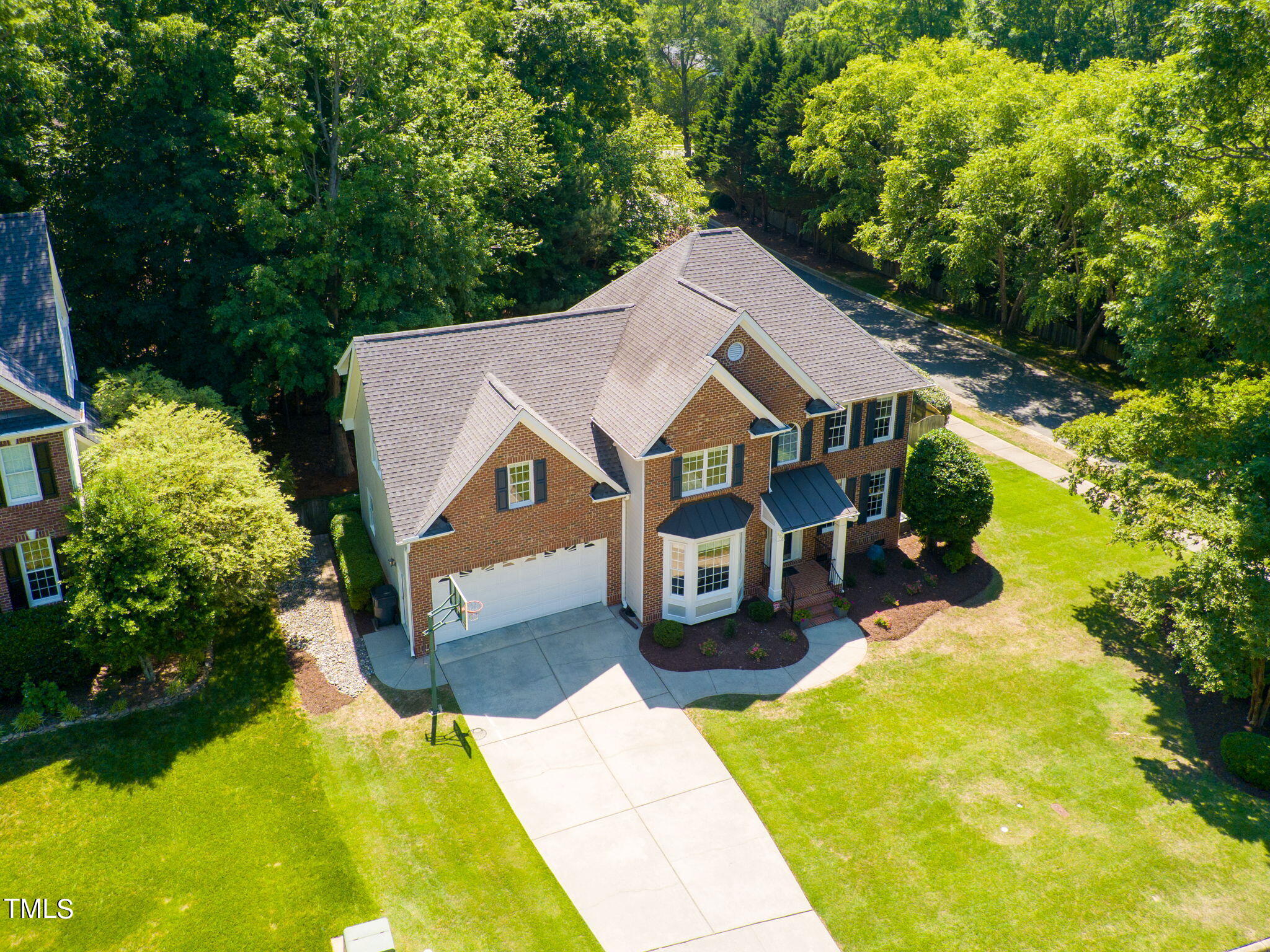 109 Chilcott Lane Apex, NC 27502 - Photo 2 of 34 a aerial view of a house with swimming pool and large trees