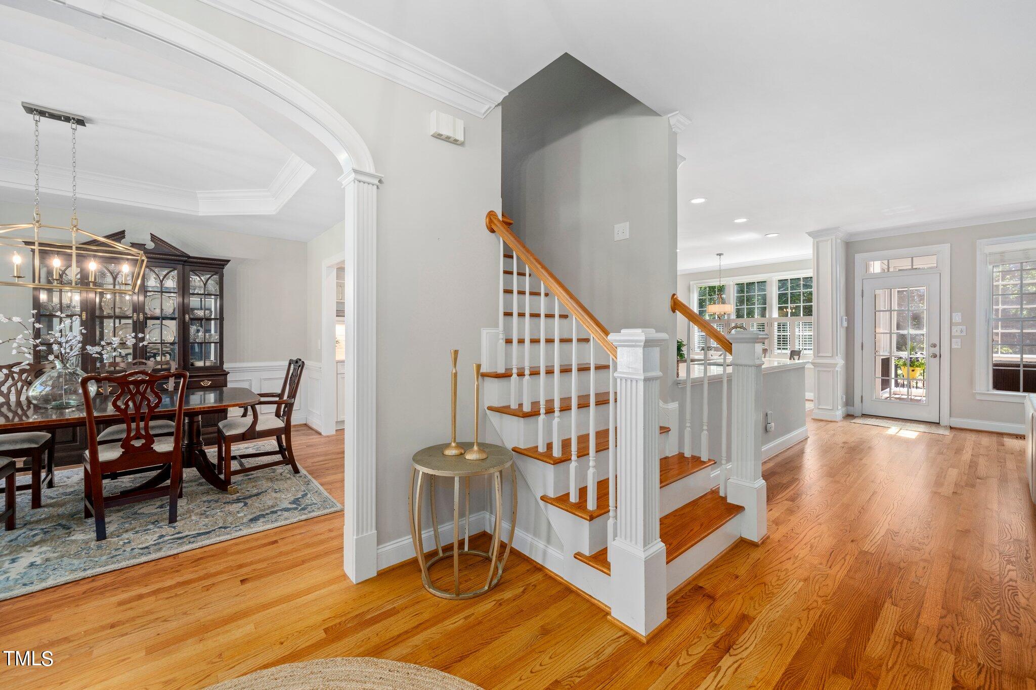 109 Chilcott Lane Apex, NC 27502 - Photo 3 of 34 a view of front door with dining room and wooden floor