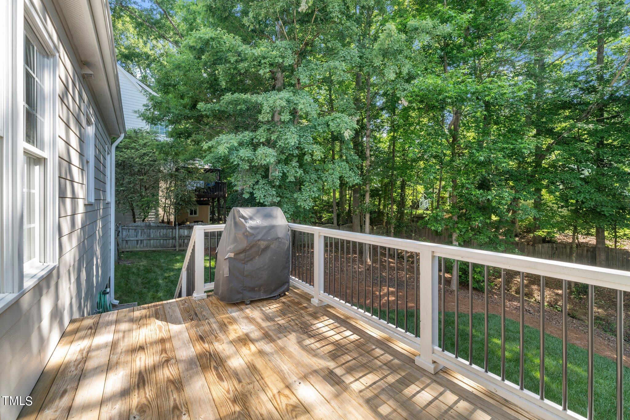 109 Chilcott Lane Apex, NC 27502 - Photo 31 of 34 a view of a roof deck with wooden fence and floor