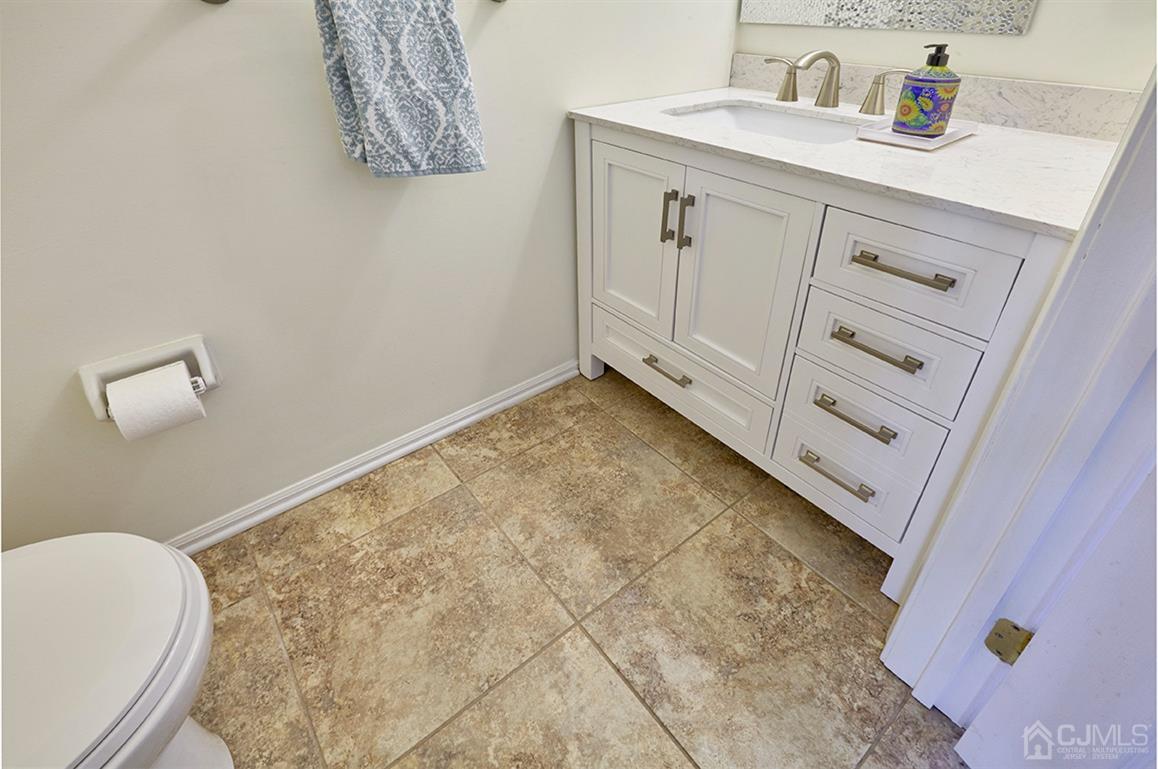 26 Glacier Drive Howell, NJ 07731 - Photo 13 of 31 a bathroom with a sink and a vanity