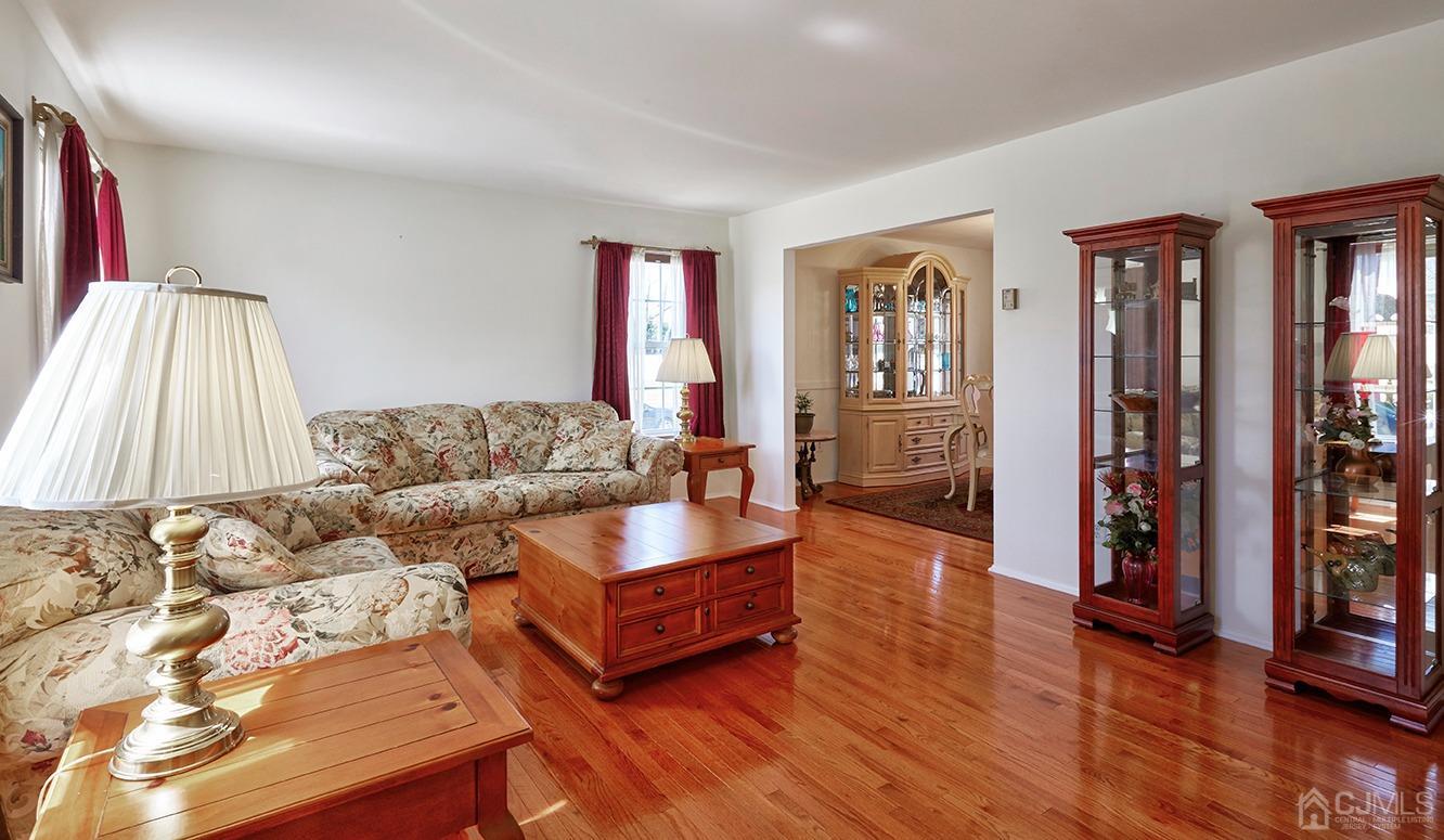 26 Glacier Drive Howell, NJ 07731 - Photo 2 of 31 a living room with furniture and wooden floor