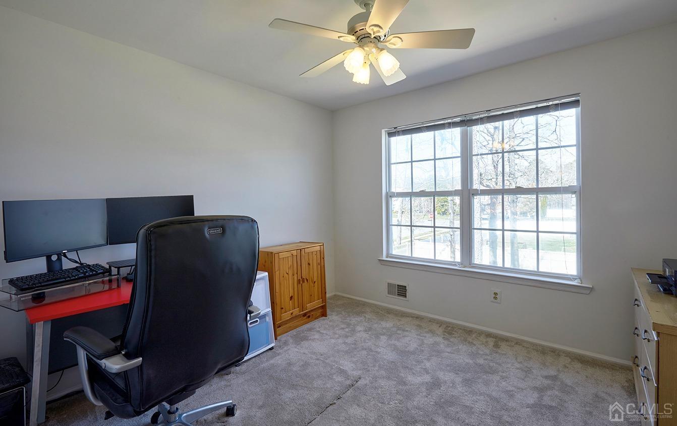 26 Glacier Drive Howell, NJ 07731 - Photo 25 of 31 a living room with furniture and a window