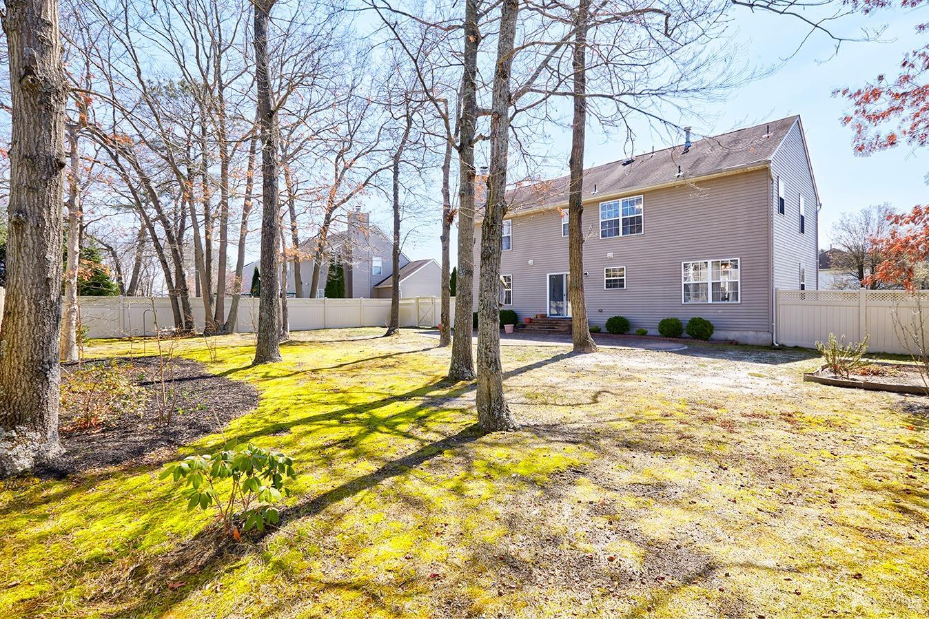 26 Glacier Drive Howell, NJ 07731 - Photo 30 of 31 a swimming pool with outdoor seating and yard