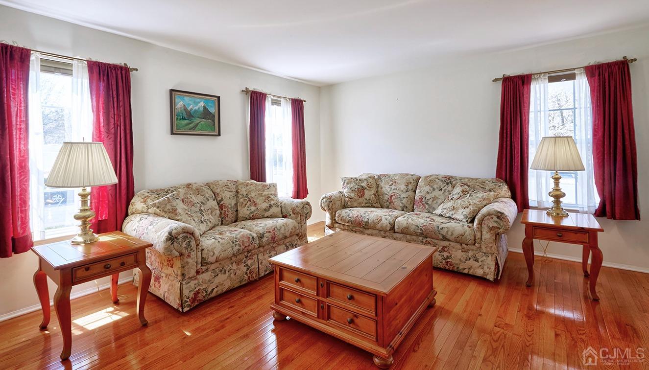 26 Glacier Drive Howell, NJ 07731 - Photo 3 of 31 a living room with furniture and a window