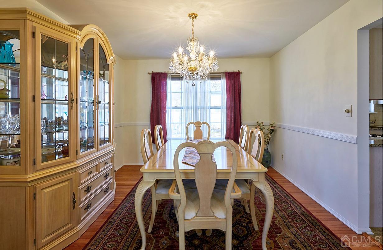 26 Glacier Drive Howell, NJ 07731 - Photo 5 of 31 a view of a dining room with furniture window and outside view