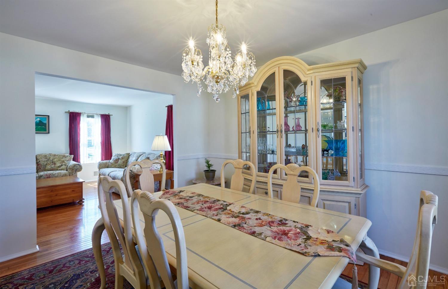 26 Glacier Drive Howell, NJ 07731 - Photo 6 of 31 a view of a dining room with furniture wooden floor and chandelier