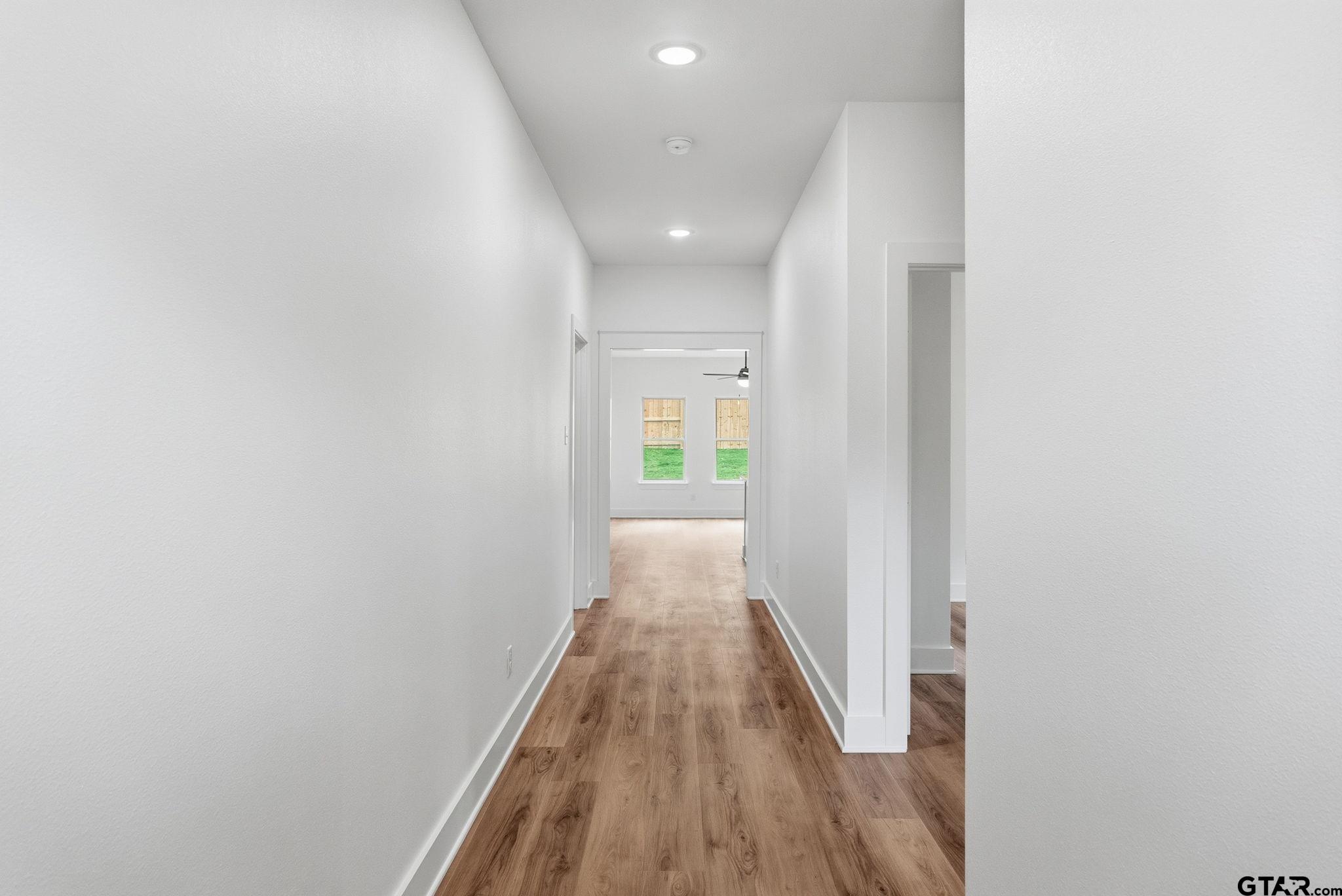 2968 Calloway Road Tyler, TX 75701 - Photo 3 of 24 a view of a hallway with wooden floor