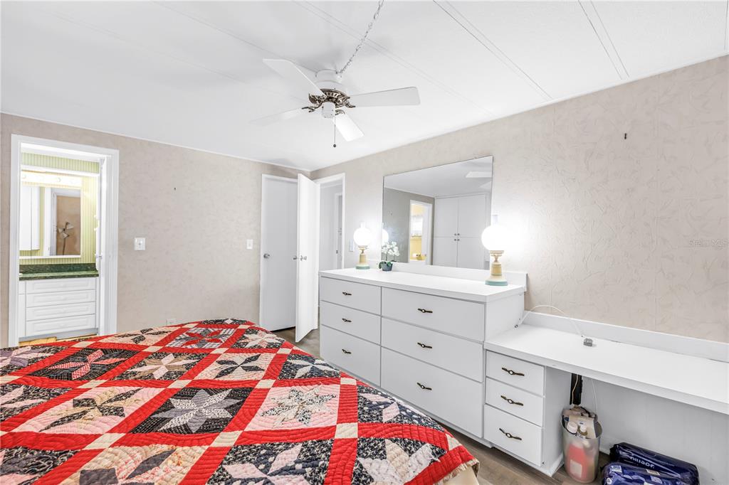 1100 South Belcher Road, Unit 502 Largo, FL 33771 - Photo 19 of 51 a bedroom with a bed and a dresser