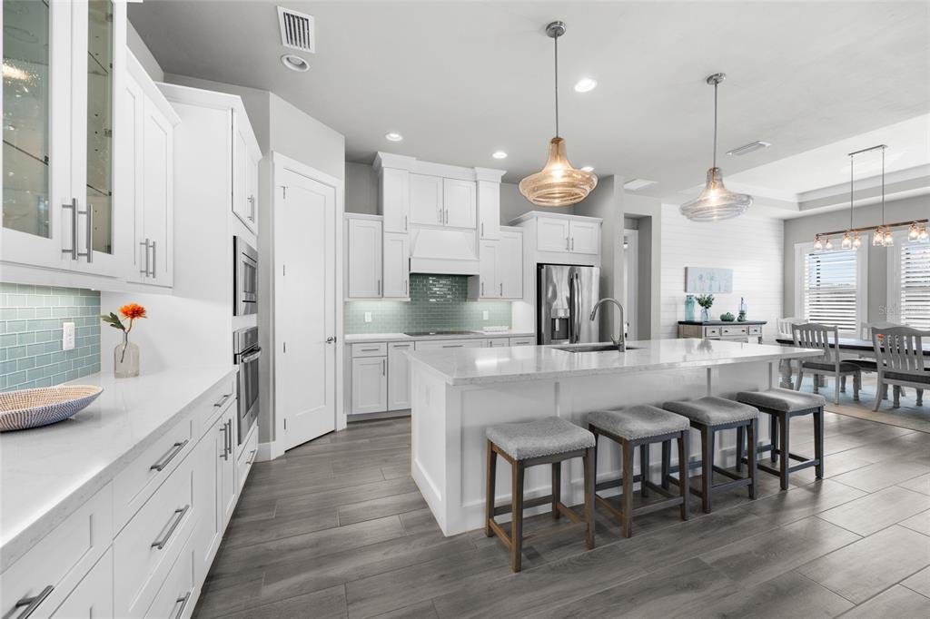 11949 Southwest 33 Lane Gainesville, FL 32608 - Photo 11 of 43 a large kitchen with a table and chairs