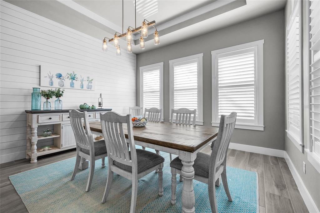11949 Southwest 33 Lane Gainesville, FL 32608 - Photo 15 of 43 a view of a dining room with furniture and window