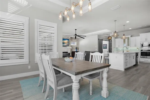 a dining room with furniture and window
