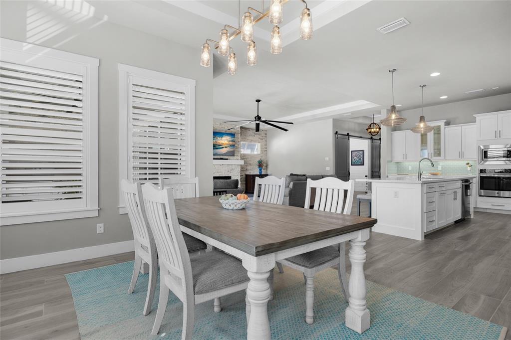 11949 Southwest 33 Lane Gainesville, FL 32608 - Photo 16 of 43 a dining room with furniture and window