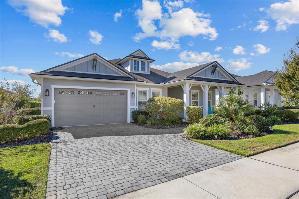 11949 Southwest 33 Lane Gainesville, FL 32608 - Photo 2 of 43 a front view of a house with a garden