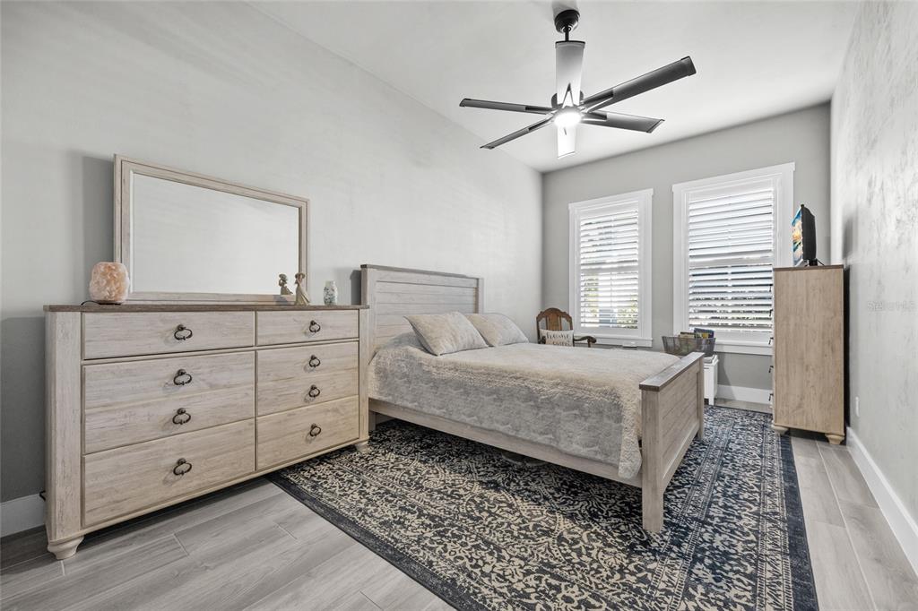 11949 Southwest 33 Lane Gainesville, FL 32608 - Photo 22 of 43 a bedroom with a bed and a dresser