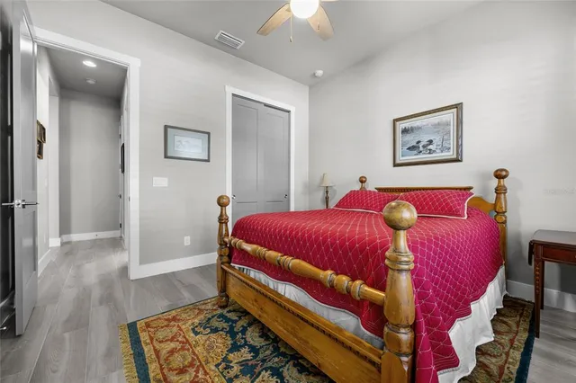 a bed room with a bed and a chandelier