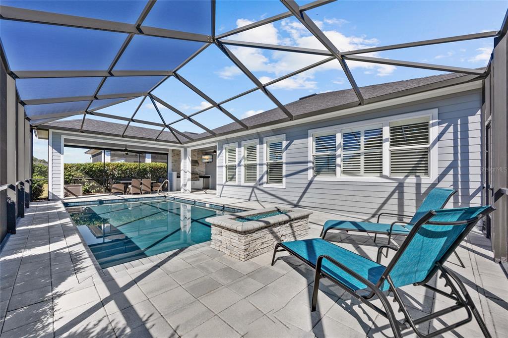 11949 Southwest 33 Lane Gainesville, FL 32608 - Photo 34 of 43 a view of a patio with table and chairs