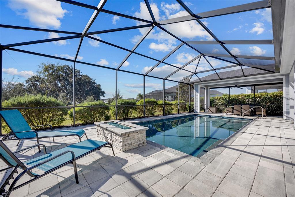 11949 Southwest 33 Lane Gainesville, FL 32608 - Photo 35 of 43 a view of a patio with a table and chairs