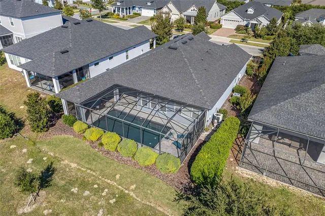 an aerial view of a house with a swimming pool