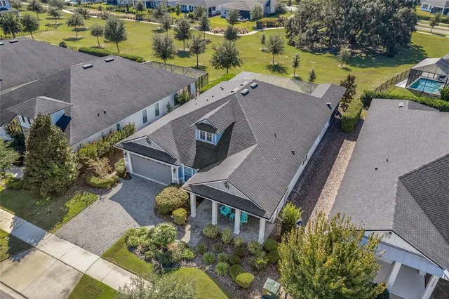 an aerial view of a house with a swimming pool