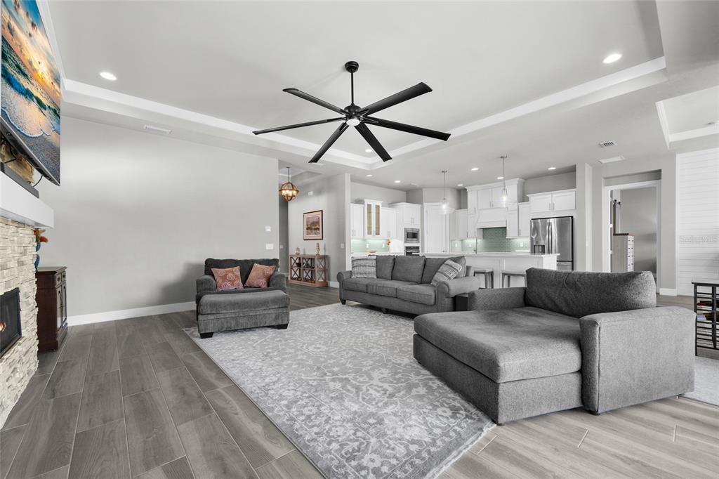 11949 Southwest 33 Lane Gainesville, FL 32608 - Photo 7 of 43 a living room with furniture and a fireplace