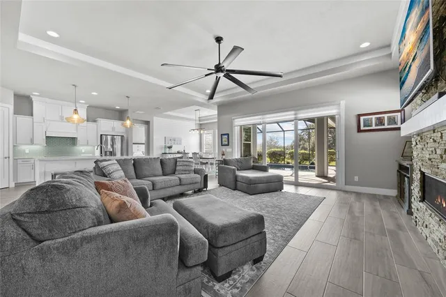 a living room with furniture and a fireplace