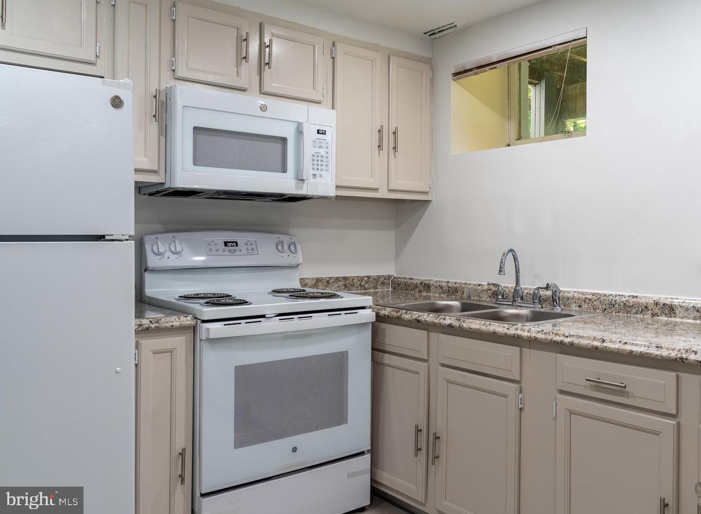 14913 Lear Lane Silver Spring, MD 20905 - Photo 28 of 33 Modern kitchen with sleek finishes.