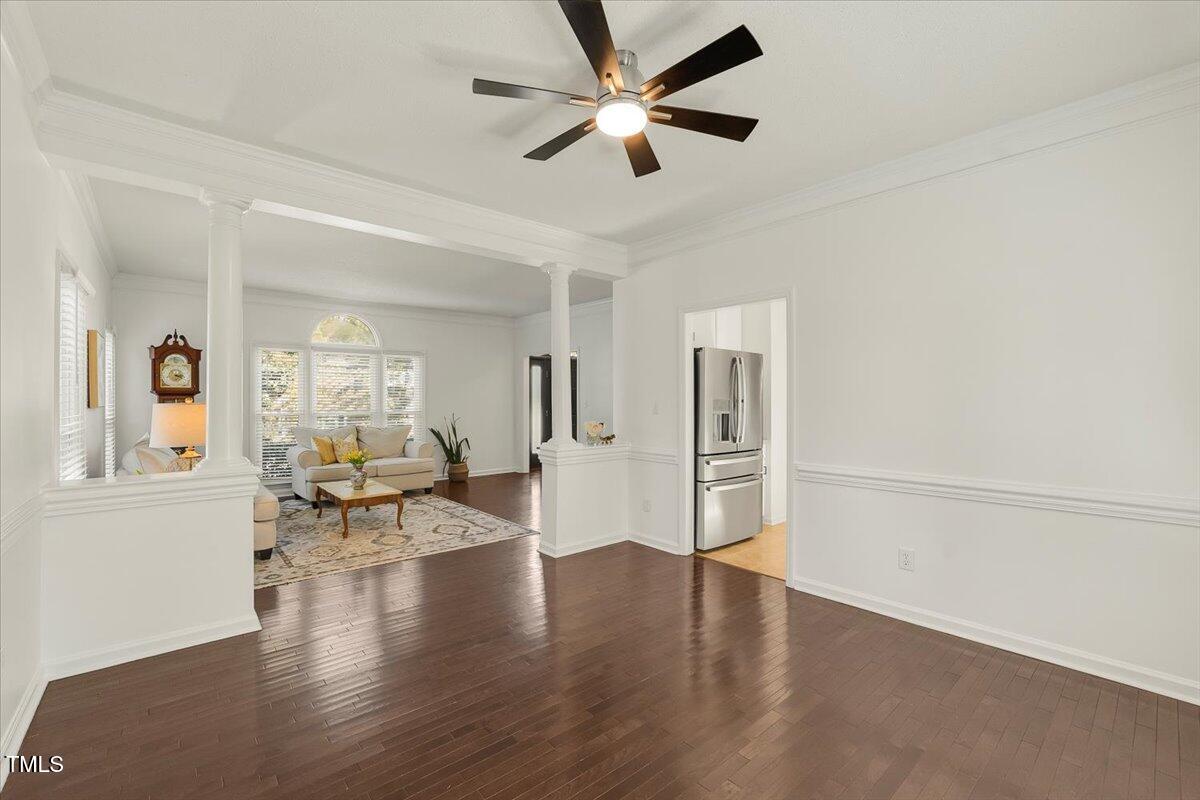 9813 Rockledge Drive Raleigh, NC 27617 - Photo 11 of 52 a view of an livingroom with furniture wooden floor and a ceiling fan