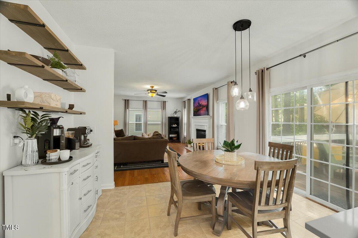 9813 Rockledge Drive Raleigh, NC 27617 - Photo 17 of 52 a view of a dining room with furniture window and outside view