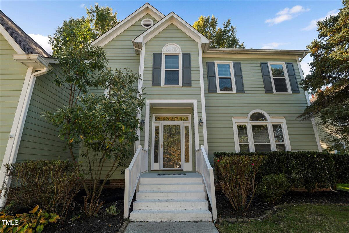 9813 Rockledge Drive Raleigh, NC 27617 - Photo 2 of 52 a front view of a house with a yard