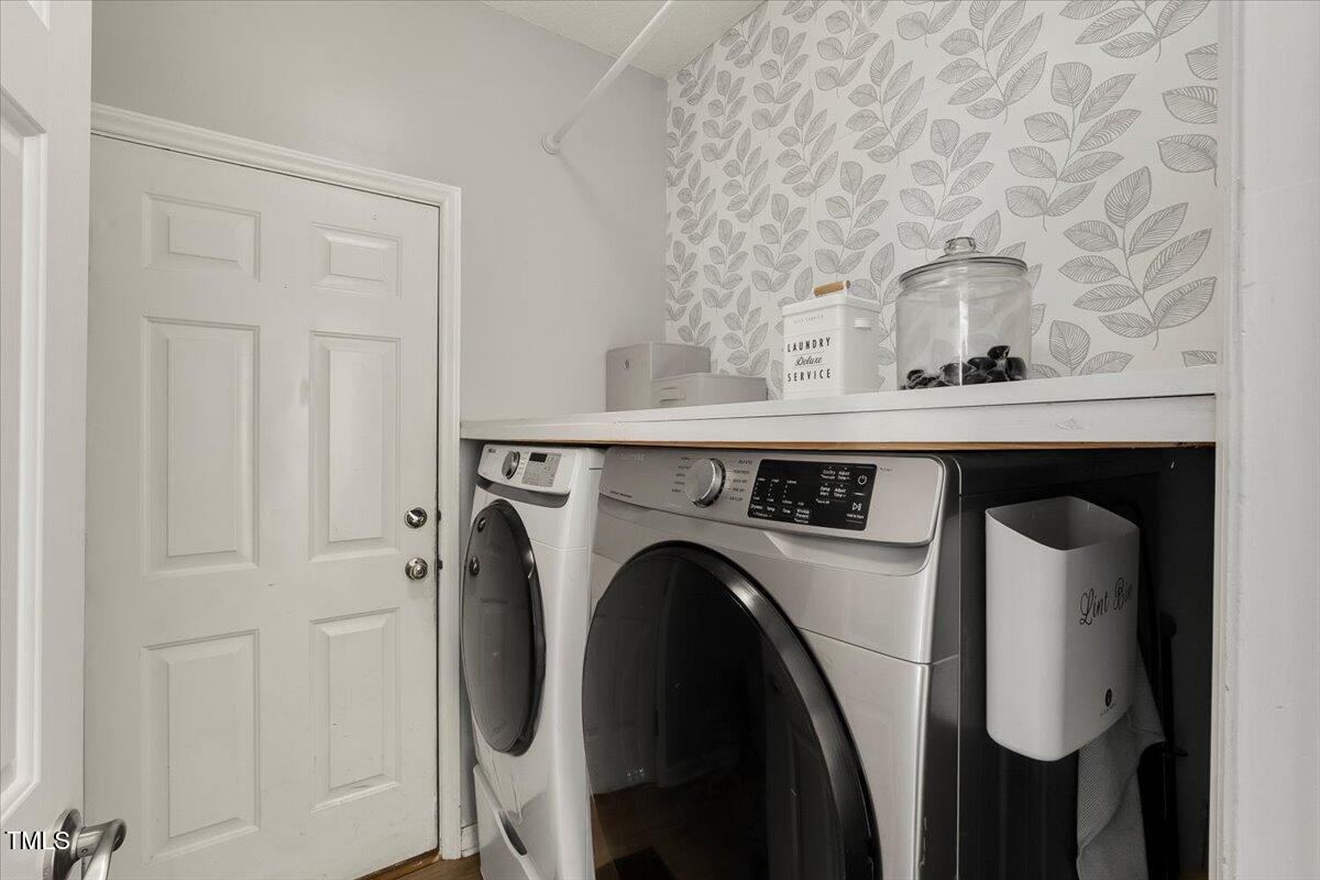 9813 Rockledge Drive Raleigh, NC 27617 - Photo 26 of 52 a utility room with dryer and washer