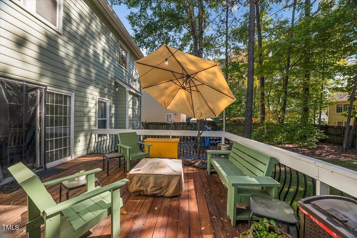 9813 Rockledge Drive Raleigh, NC 27617 - Photo 28 of 52 a view of sitting area with furniture and wooden deck
